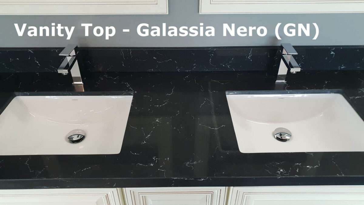 Black vanity top with two sinks, labeled "Galassia Nero (GN)."
