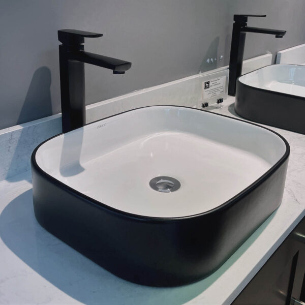 square basin with black surface basin