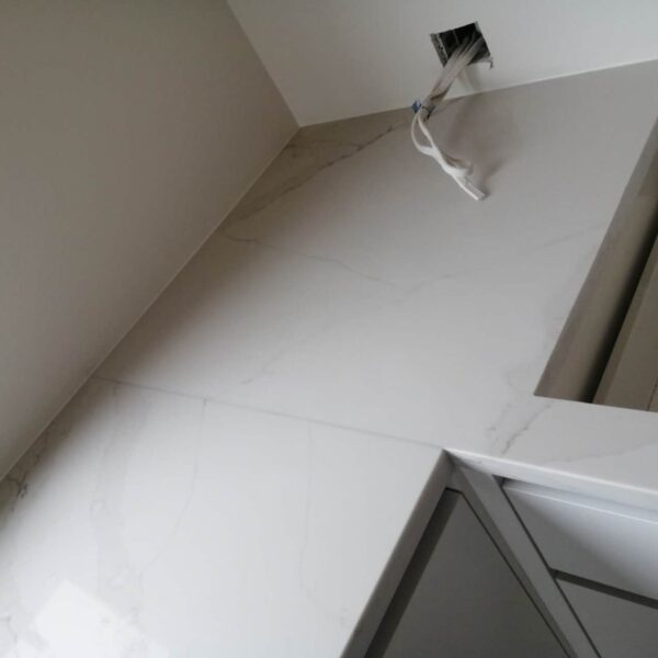 Calacatta Belleza countertop installation in modern kitchen.