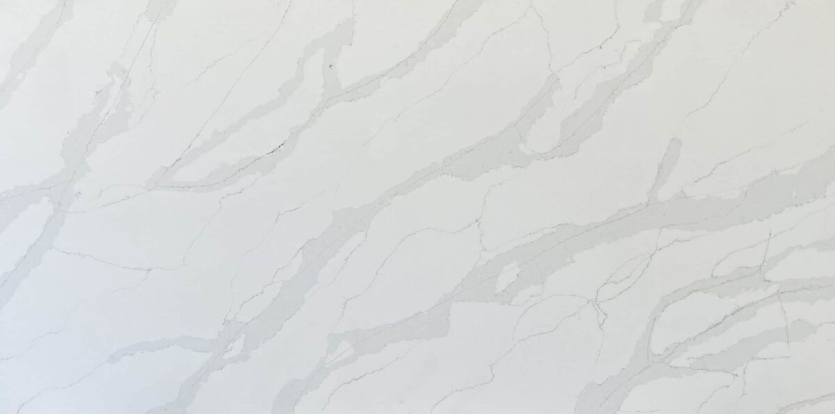 White marble countertop with subtle gray veining pattern.