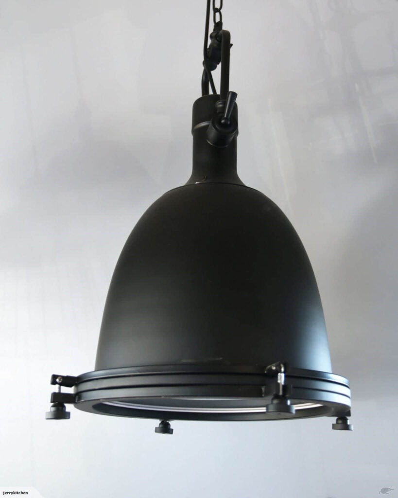 Hanging black industrial-style pendant light fixture.