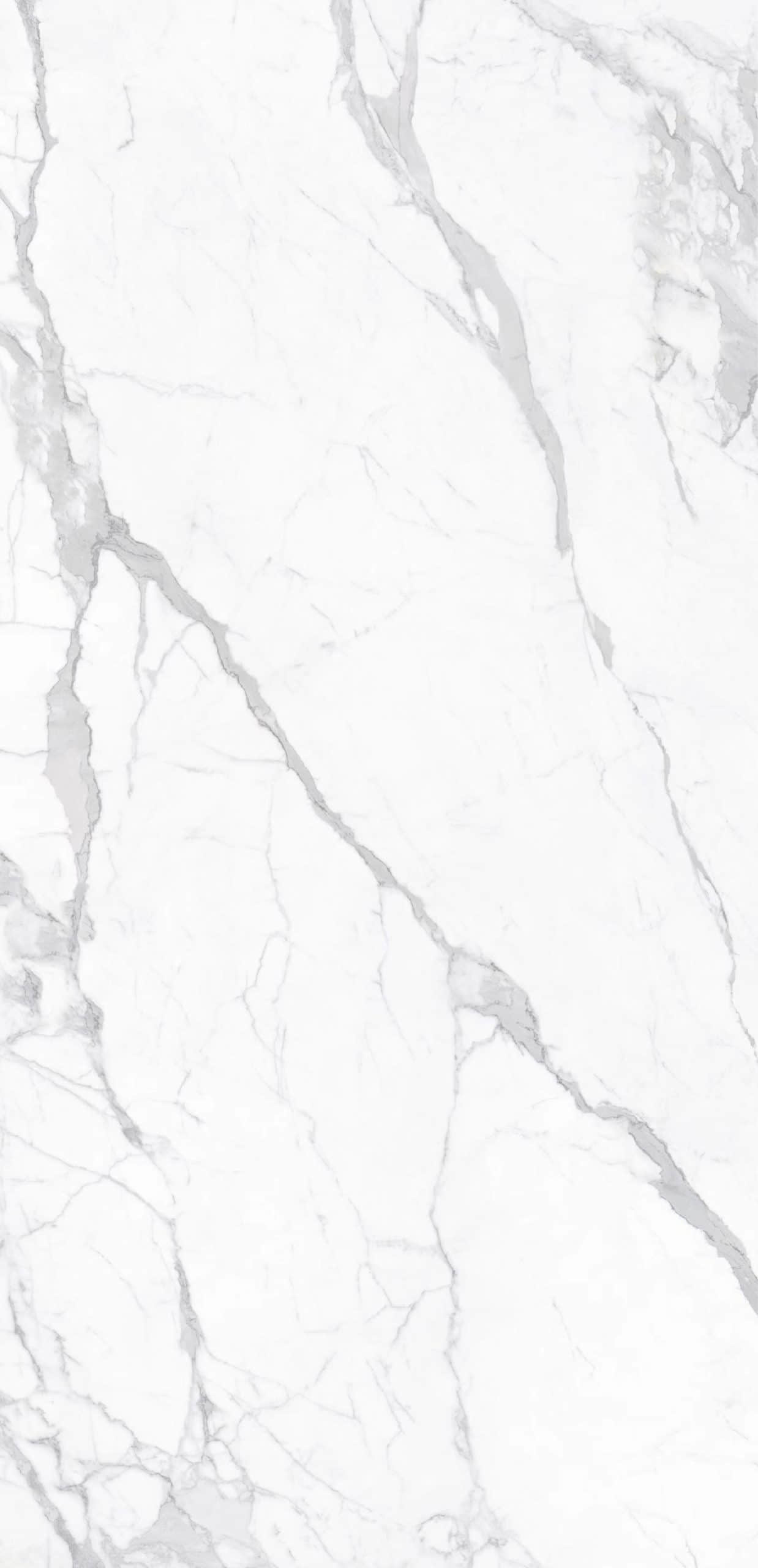 Sintered stone Statuario slab with white and gray veining.